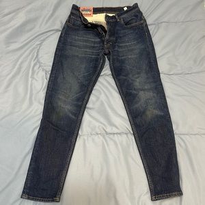 Acne tapered jeans.